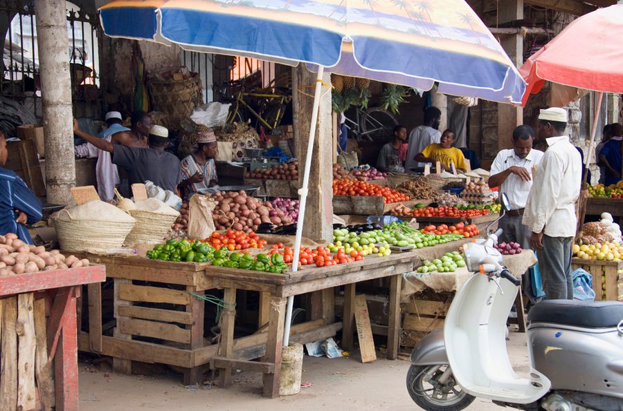 Mama Mboga market trader with fresh produce